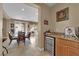 Wet bar including cooler, small sink and storage space near the dining table at 9614 Stonily Ln, Las Vegas, NV 89178