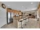 Open kitchen with granite island, stainless appliances, and a seamless flow to dining and living areas at 9614 Stonily Ln, Las Vegas, NV 89178