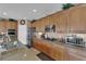 Well-equipped kitchen with granite counters, stainless appliances, including double ovens and gas cooktop at 9614 Stonily Ln, Las Vegas, NV 89178
