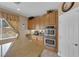 Kitchen featuring stainless double ovens and granite counterspace at 9614 Stonily Ln, Las Vegas, NV 89178