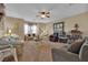 Open living room with carpet flooring, ceiling fan, and coordinated furniture at 9614 Stonily Ln, Las Vegas, NV 89178