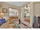 Comfortable living room with view of staircase and dining room at 9614 Stonily Ln, Las Vegas, NV 89178