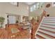 Bright living room with hardwood floors, staircase, and an open floor plan at 9614 Stonily Ln, Las Vegas, NV 89178