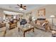 Bright living room with tile floors, comfortable seating, and a view into the kitchen at 9614 Stonily Ln, Las Vegas, NV 89178