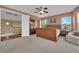 Bright main bedroom with carpet, a ceiling fan, and lots of natural light at 9614 Stonily Ln, Las Vegas, NV 89178