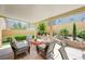 Cozy covered patio featuring a fire pit and seating area, perfect for outdoor gatherings at 9729 Hawk Crest St, Las Vegas, NV 89141