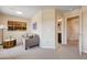 Bright bedroom featuring sitting area, neutral walls, and an ensuite bathroom at 9729 Hawk Crest St, Las Vegas, NV 89141