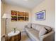 A cozy sitting area in a bedroom with neutral walls and decor at 9729 Hawk Crest St, Las Vegas, NV 89141