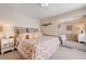 Bedroom featuring floral bedding and a mirrored closet at 9729 Hawk Crest St, Las Vegas, NV 89141
