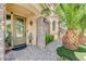 Inviting front door entrance with decorative plants and a brick walkway at 9729 Hawk Crest St, Las Vegas, NV 89141