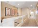 Upstairs hallway with carpet and framed art at 9729 Hawk Crest St, Las Vegas, NV 89141