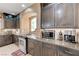 Modern kitchen features stainless steel oven, custom cabinets and granite countertops at 9729 Hawk Crest St, Las Vegas, NV 89141