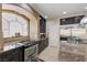 Modern kitchen features stainless steel oven, custom cabinets, and stainless steel refrigerator at 9729 Hawk Crest St, Las Vegas, NV 89141