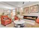 Elegant living room featuring a modern fireplace and neutral tones at 9729 Hawk Crest St, Las Vegas, NV 89141