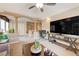 Upstairs living room area with desk, TV, seating, and architectural details at 9729 Hawk Crest St, Las Vegas, NV 89141