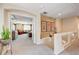 Upstairs hallway looking into a living space with furniture and decor at 9729 Hawk Crest St, Las Vegas, NV 89141
