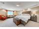 Spacious main bedroom with sitting area and plush carpets at 9729 Hawk Crest St, Las Vegas, NV 89141
