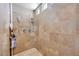 Tiled shower stall featuring multiple shower heads and a built-in shelving niche at 9729 Hawk Crest St, Las Vegas, NV 89141