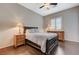 Bedroom with hardwood floors, dresser, and a ceiling fan at 334 Cougar Estates Ln, Las Vegas, NV 89123