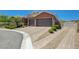 Beautiful brick driveway and mature landscaping leading to the three-car garage at 334 Cougar Estates Ln, Las Vegas, NV 89123