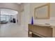 Bright entryway featuring tile flooring, decorative mirror, and views into the living area at 334 Cougar Estates Ln, Las Vegas, NV 89123