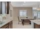 Convenient dining area located near the kitchen with custom dark cabinetry and stainless steel hardware at 334 Cougar Estates Ln, Las Vegas, NV 89123