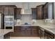 Contemporary kitchen with granite counters, stainless steel appliances, and stone backsplash at 334 Cougar Estates Ln, Las Vegas, NV 89123