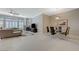 Open living room featuring tile floors, fireplace, and a modern dining set at 334 Cougar Estates Ln, Las Vegas, NV 89123