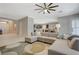 Open-concept home featuring a sizable living room with seamless transitions into dining and kitchen areas at 334 Cougar Estates Ln, Las Vegas, NV 89123