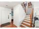 Inviting entryway with wood floors, staircase, and neutral walls for a welcoming first impression at 10253 Martinsburg Ct, Las Vegas, NV 89183