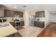 Modern kitchen with stainless steel appliances, mosaic backsplash, and ample cabinet space at 10253 Martinsburg Ct, Las Vegas, NV 89183