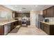 Bright kitchen featuring stainless steel appliances, updated countertops, and hardwood floors at 10253 Martinsburg Ct, Las Vegas, NV 89183