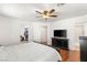 Bright main bedroom with wood floors, access to ensuite bathroom and walk-in closet at 10253 Martinsburg Ct, Las Vegas, NV 89183