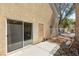 Inviting patio with sliding glass door, patio furniture, and view of greenery with privacy fence at 10253 Martinsburg Ct, Las Vegas, NV 89183