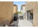 Cozy outdoor patio with patio furniture, ideal for relaxation and entertaining with block wall for privacy at 10253 Martinsburg Ct, Las Vegas, NV 89183