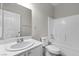 Bright bathroom featuring a single sink vanity, toilet, and shower-tub combination at 10613 Tiffanieville Ct, Las Vegas, NV 89129