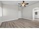 Primary bedroom offers wood-style flooring and access to the bathroom at 10613 Tiffanieville Ct, Las Vegas, NV 89129