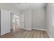 Spacious bedroom with wood-style floors and entry to next room at 10613 Tiffanieville Ct, Las Vegas, NV 89129