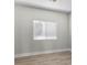 Bright bedroom with wood-style flooring and a window for natural light at 10613 Tiffanieville Ct, Las Vegas, NV 89129