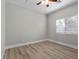 Cozy bedroom with wood-style flooring and lots of natural light at 10613 Tiffanieville Ct, Las Vegas, NV 89129
