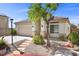 Inviting single story home with a well-maintained yard and desert landscaping at 10613 Tiffanieville Ct, Las Vegas, NV 89129
