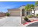 Charming single story home with a two car garage and low maintenance landscaping at 10613 Tiffanieville Ct, Las Vegas, NV 89129