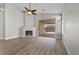 Spacious living room featuring fireplace, patio access, and modern flooring at 10613 Tiffanieville Ct, Las Vegas, NV 89129