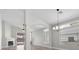Spacious living room with fireplace, modern chandelier, and large windows at 10613 Tiffanieville Ct, Las Vegas, NV 89129