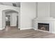 Open living room featuring a cozy fireplace and neutral flooring at 10613 Tiffanieville Ct, Las Vegas, NV 89129