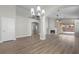Open concept living room featuring a fireplace and access to an outdoor patio at 10613 Tiffanieville Ct, Las Vegas, NV 89129