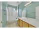 Bright bathroom features a shower over tub, neutral tile floor and solid surface vanity at 108 Lemon Glaze St # 202, Las Vegas, NV 89145