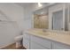 Bathroom with white cabinets, a white countertop, and a large mirror at 1101 Willow Tree Dr # D, Las Vegas, NV 89128