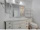 Clean bathroom with a marble countertop vanity, ample storage, and modern fixtures at 1101 Willow Tree Dr # D, Las Vegas, NV 89128