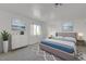 Serene bedroom featuring a plush bed, soft colors, and decorative ocean-themed artwork at 1101 Willow Tree Dr # D, Las Vegas, NV 89128